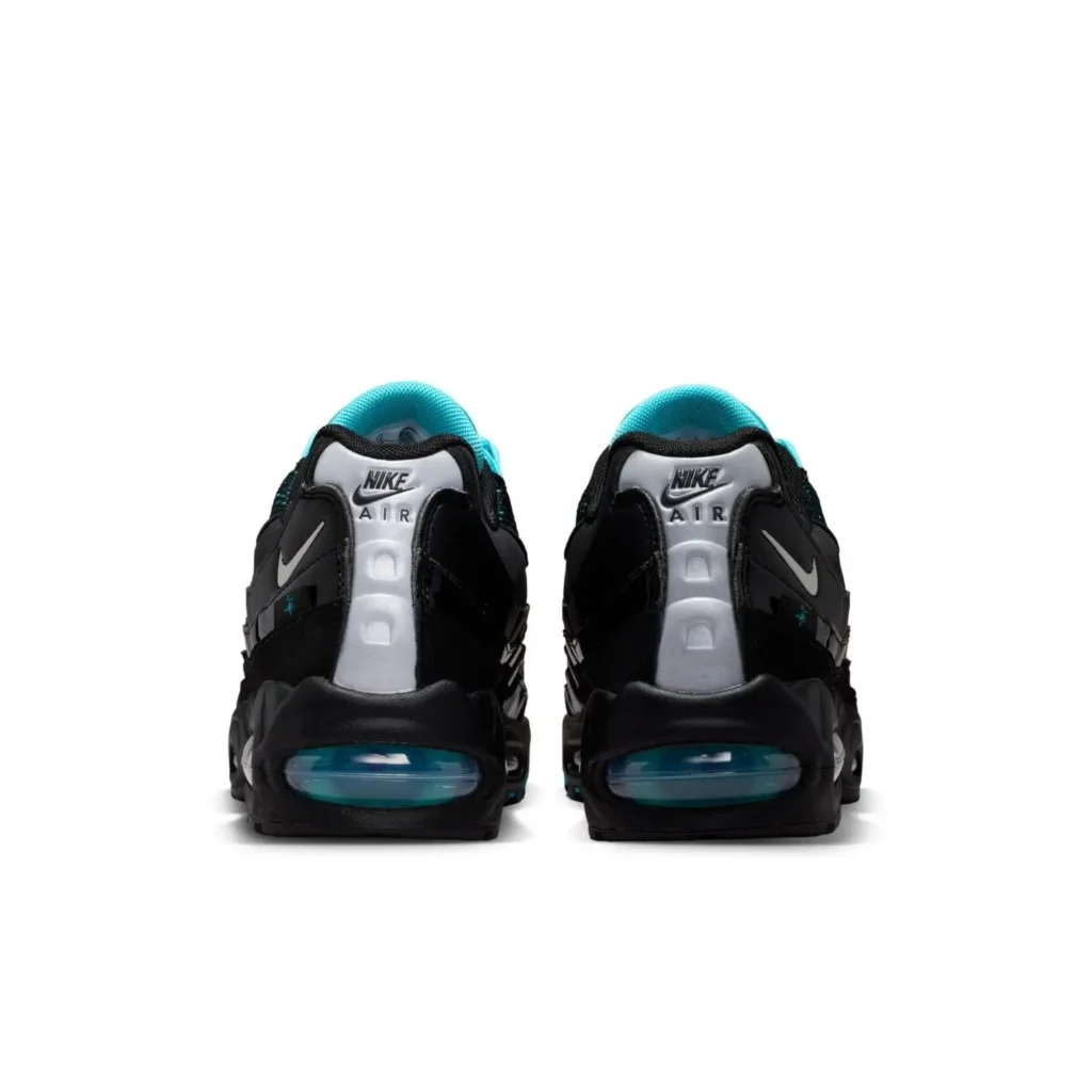Rear view of the Nike Air Max 95 pair highlighting reflective silver heel tabs with Nike Air branding, aqua lining, black uppers, and blue-tinted view Air unit