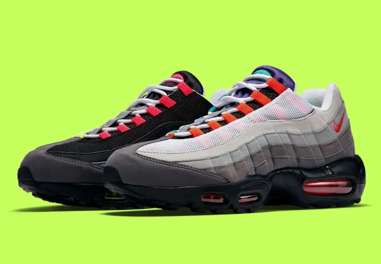 Promotional image of the mismatched Nike Air Max 95 against a bright lime-green background, emphasizing inverted black-and-white uppers, colorful lace loops, grey overlays, and red-tinted Air Max cushion