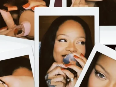 Collage of Polaroid-style photographs featuring Rihanna applying makeup and smiling while holding a Fenty Beauty compact. The warm-toned campaign image showcases close-up beauty shots, glowing skin, sleek black hair, coral-red nails, and an intimate behind-the-scenes aesthetic