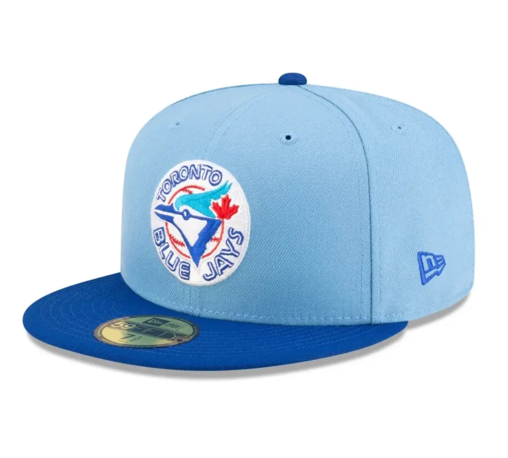 Light blue Diet Starts Monday x New Era Toronto Blue Jays fitted cap with a vintage Blue Jays circular logo on the front, a royal blue flat brim, matching top button, and embroidered New Era flag on the side.