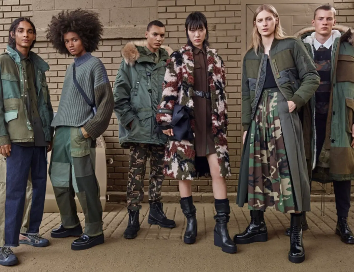 Model walks a flower-lined runway wearing pieces from the Zara SRPLS collection, featuring oversized silhouettes, faded botanical prints, and relaxed workwear-inspired tailoring.