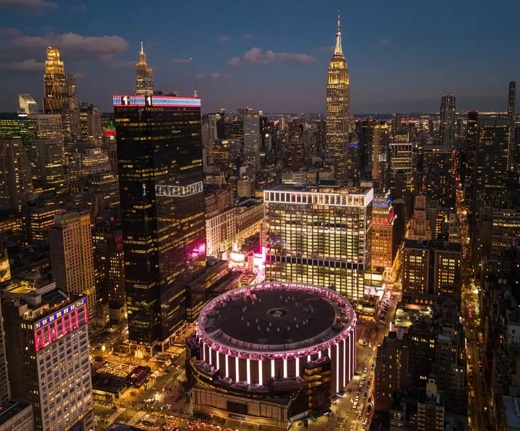 Aerial view of Madison Square Garden and the Empire State Building at dusk in Midtown Manhattan