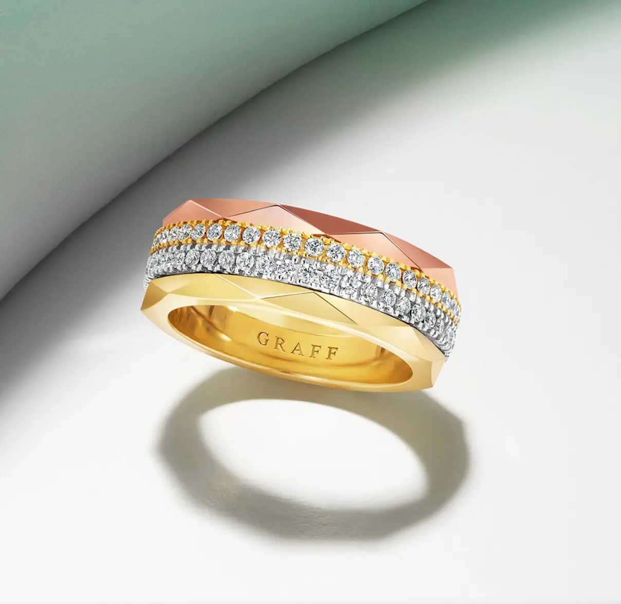 Graff geometric gold and diamond ring featuring yellow and white gold with pavé-set diamonds