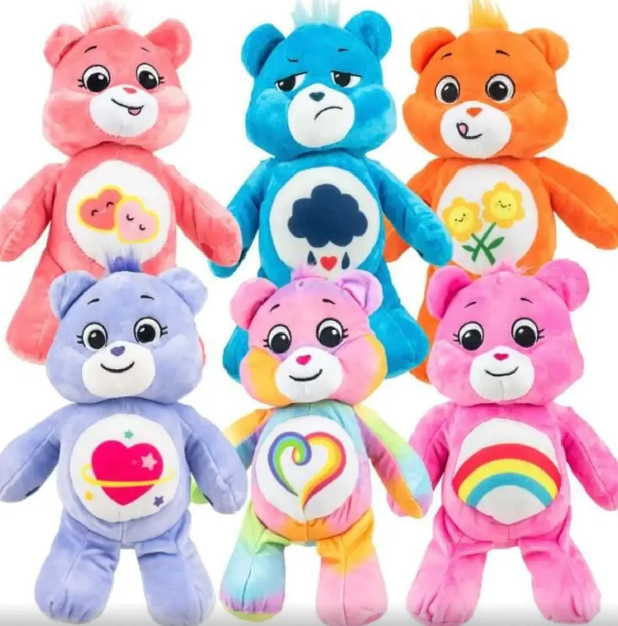 Six colorful Care Bears plush toys featuring a variety of classic characters with signature belly badges displayed on a white background.