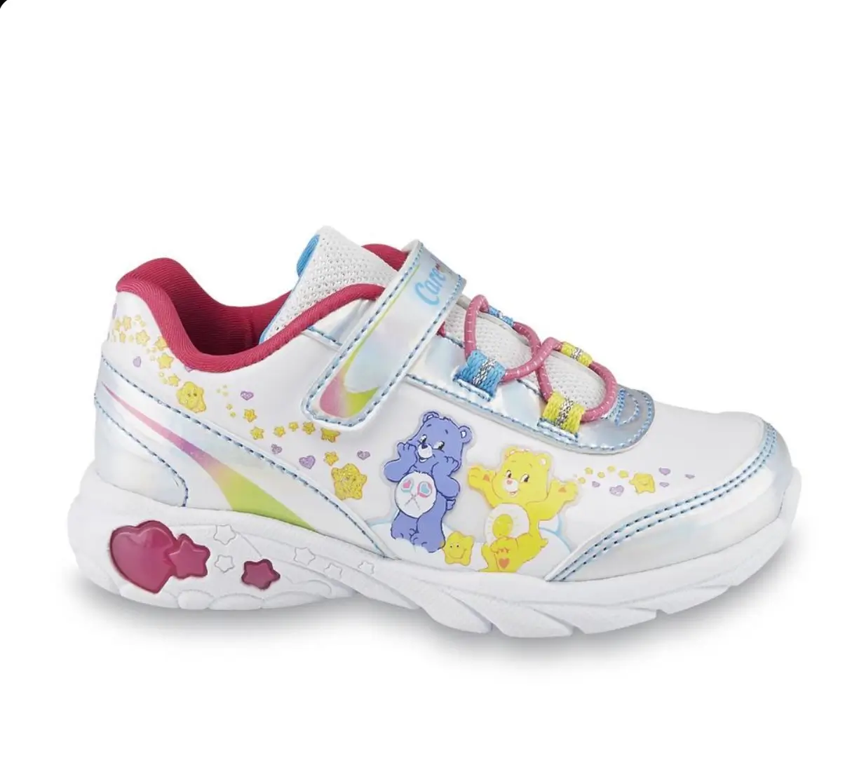 White Care Bears children's sneaker featuring colorful character graphics, rainbow accents, and playful heart and star details.
