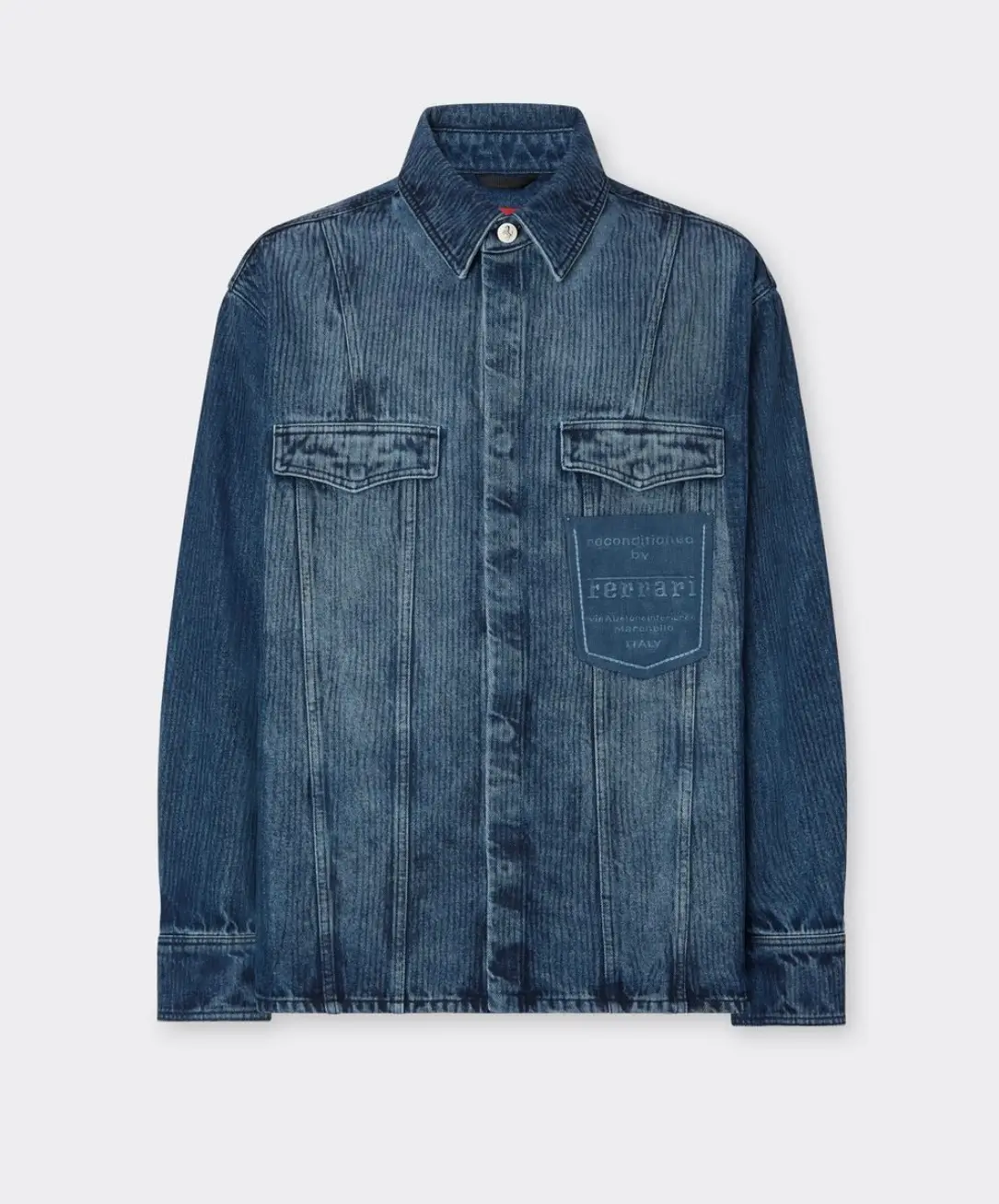 Blue Ferrari reconditioned denim overshirt with a faded indigo wash, pointed collar, dual flap chest pockets, button-front closure, and signature branded patch detail on the front pocket.