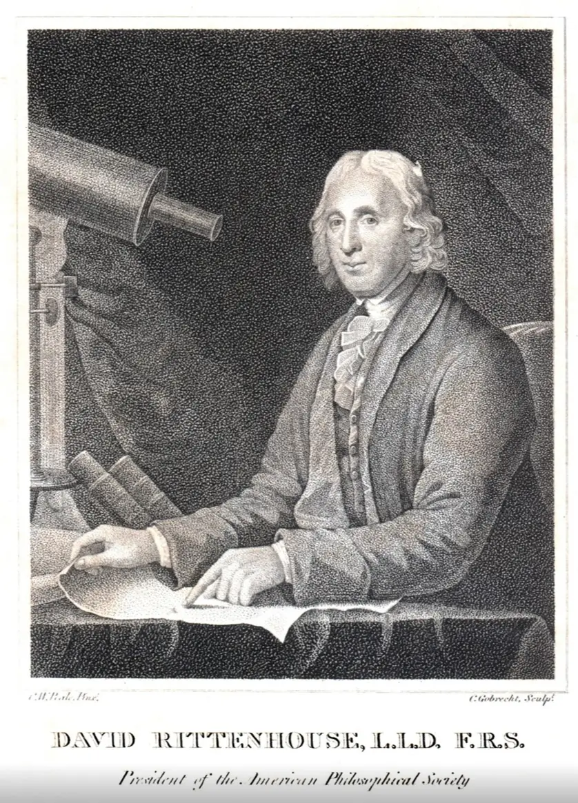 Engraved portrait of David Rittenhouse seated at a table beside a telescope, holding scientific papers. The 18th-century American astronomer and inventor wears period clothing, with books and astronomical instruments emphasizing his contributions to science and the American Philosophical Society.