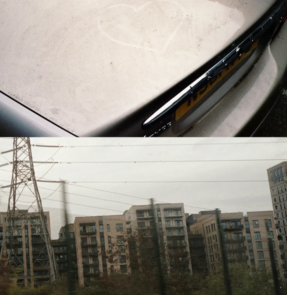Split composition pairing a close-up of a dusty silver car with an in-transit view of apartment buildings, electrical pylons, and overhead railway wire