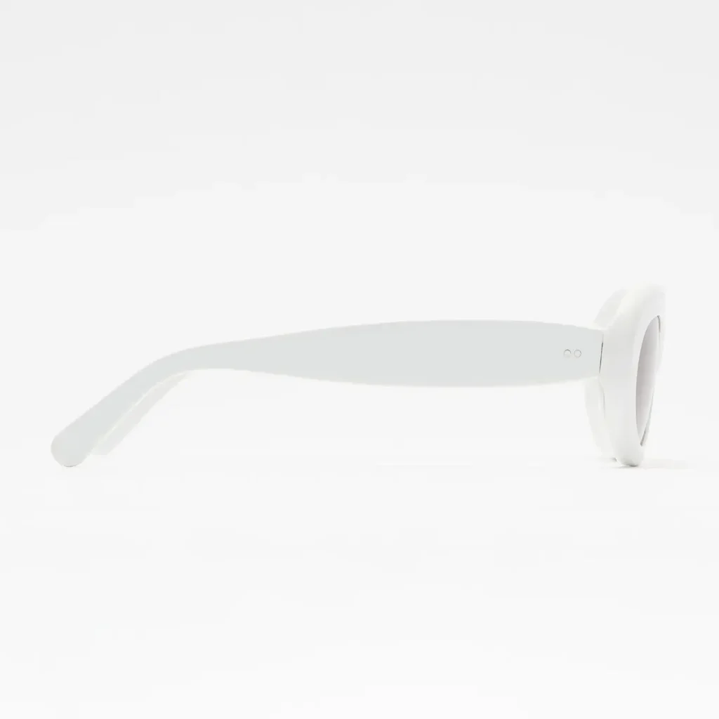 Side profile of the white acetate temple arm with gently curved fit and minimal detail