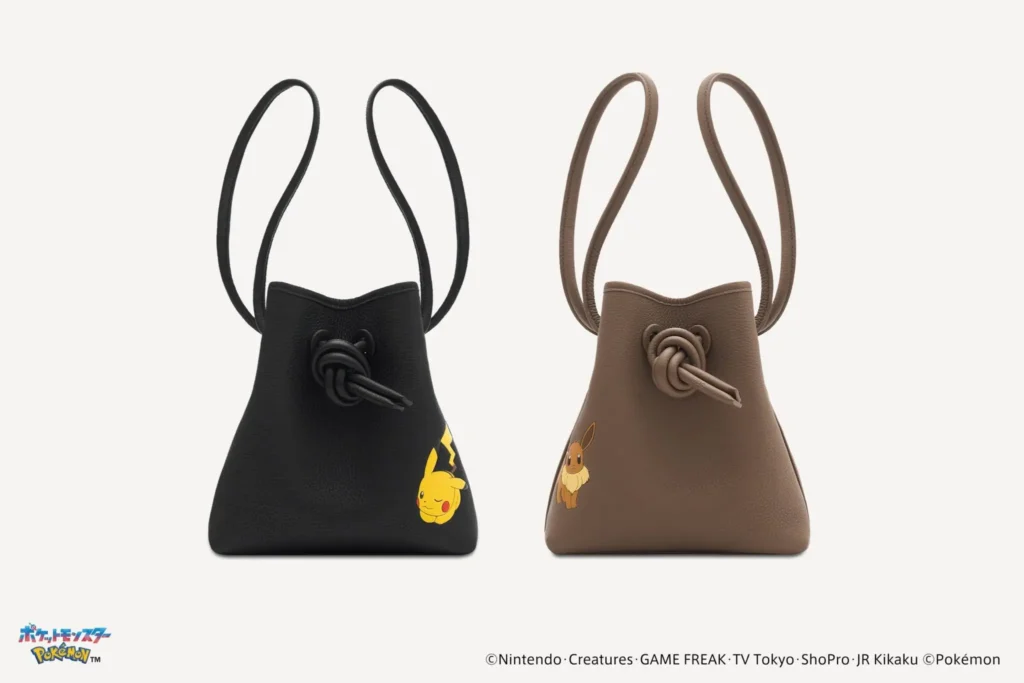 Two leather drawstring bucket bags displayed side by side, including a black version with Pikachu artwork and a brown version with Eevee artwork, each featuring matching knotted leather closures and shoulder straps