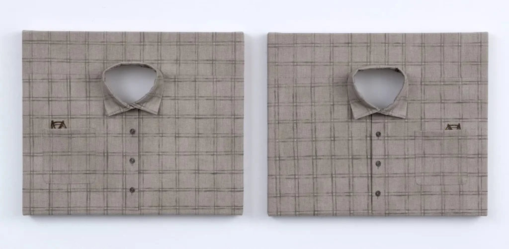 Two plaid shirt canvases displayed side by side, each depicting a folded beige check-pattern dress shirt with an open collar, chest pocket, and subtle stitched details in a trompe-l'œil textile artwork
