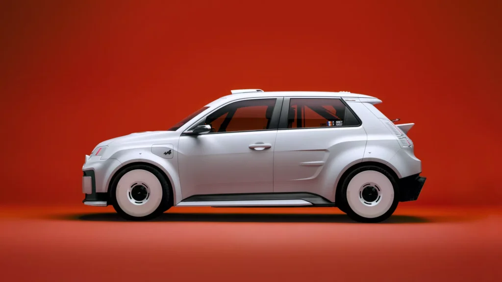 Full side profile of the silver Alpine A290 Rallye, highlighting its wide-body rally stance, white disc wheels, roof scoop, rear spoiler, and performance-focused proportion