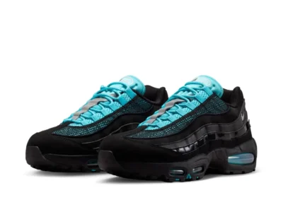 Three-quarter angled view of a pair of Nike Air Max 95 sneakers in black and aqua, showcasing the layered construction, vibrant aqua laces and mesh, glossy side panels, and signature visible Air Max sole