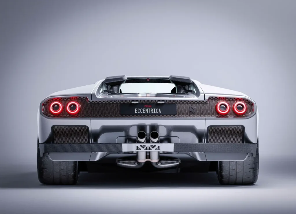Full rear view of the Eccentrica Diablo restomod highlighting circular LED taillights, central dual exhaust outlets, carbon fiber diffuser, and wide rear stance