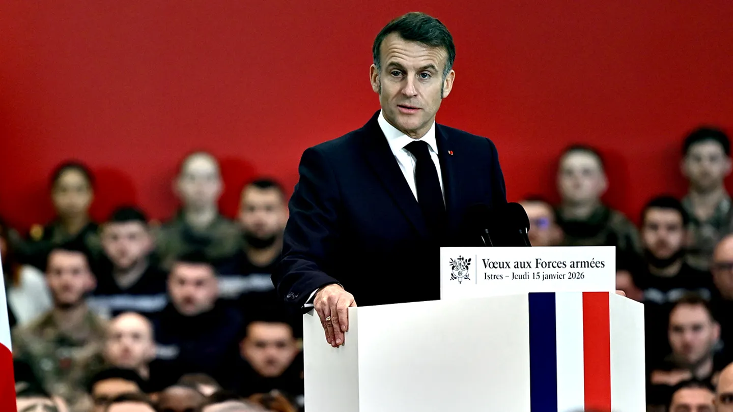 French President speaking at a podium during an official government address.