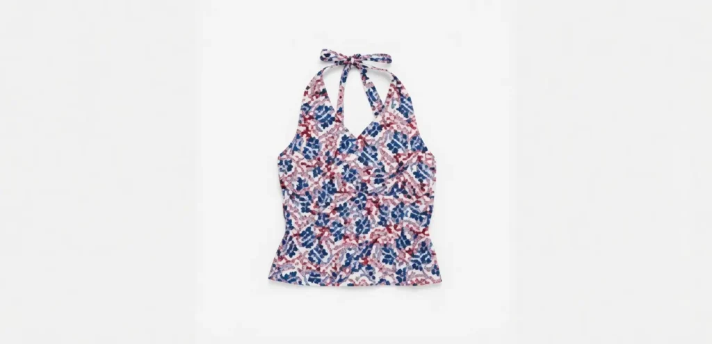 Printed halter-neck top featuring an all-over vintage-inspired graphic pattern, displayed flat against a white background