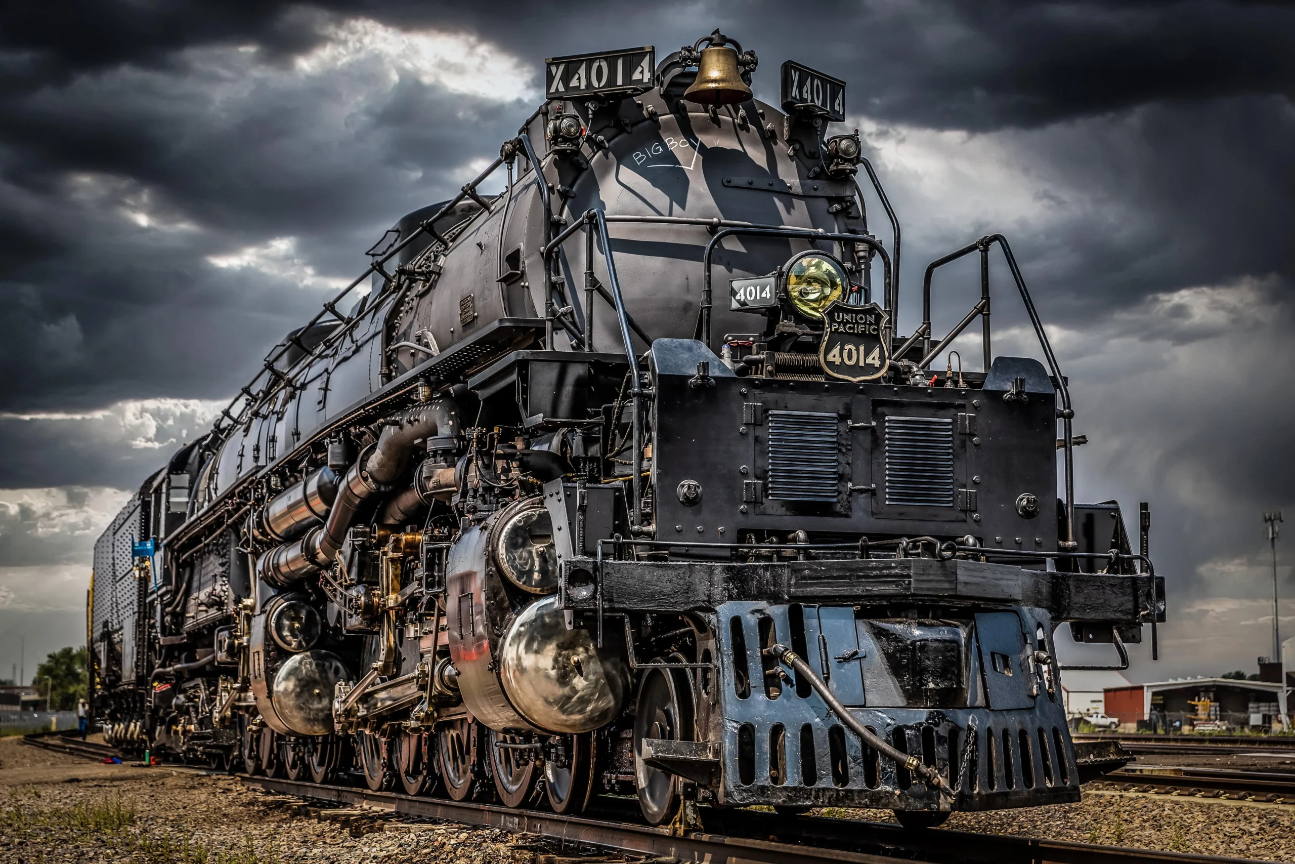 Union Pacific Big Boy No. 4014 steam locomotive under dramatic storm clouds.
