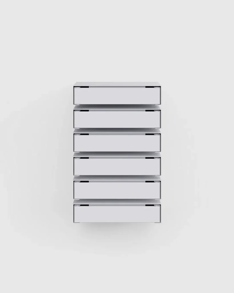 White wall-mounted modular storage drawers presented in a front-facing studio view with a min background