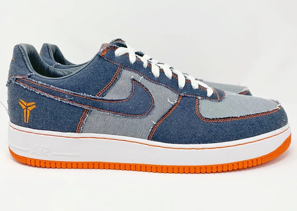 Nike Air Force 1 Low Protro Kobe Bryant denim edition featuring layered light and dark blue denim panels, contrast orange stitching, embroidered Kobe Sheath logo, white laces, white midsole, and bright orange outsole.