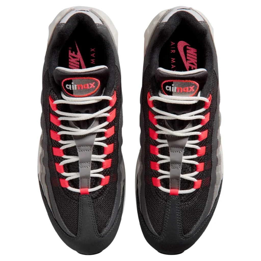 Top-down view of the Nike Air Max 95 Big Bubble "Solar Red" showing black mesh construction, white rope laces woven through Solar Red lace loops, Air Max tongue logos, and branded insole
