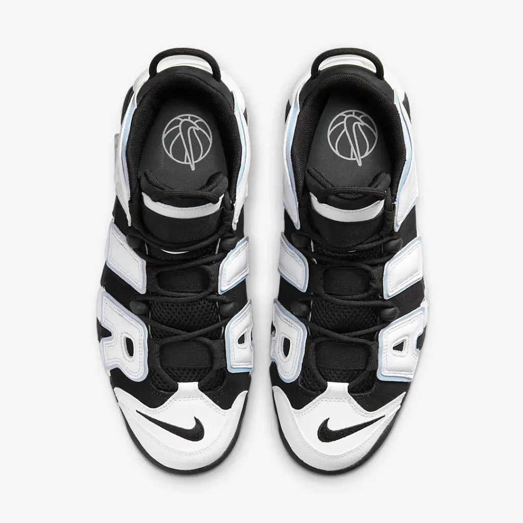 Overhead look at the pair displaying black mesh tongues, rope laces with lace locks, white leather overlays, embroidered black Swooshes on the toe, and branded insole