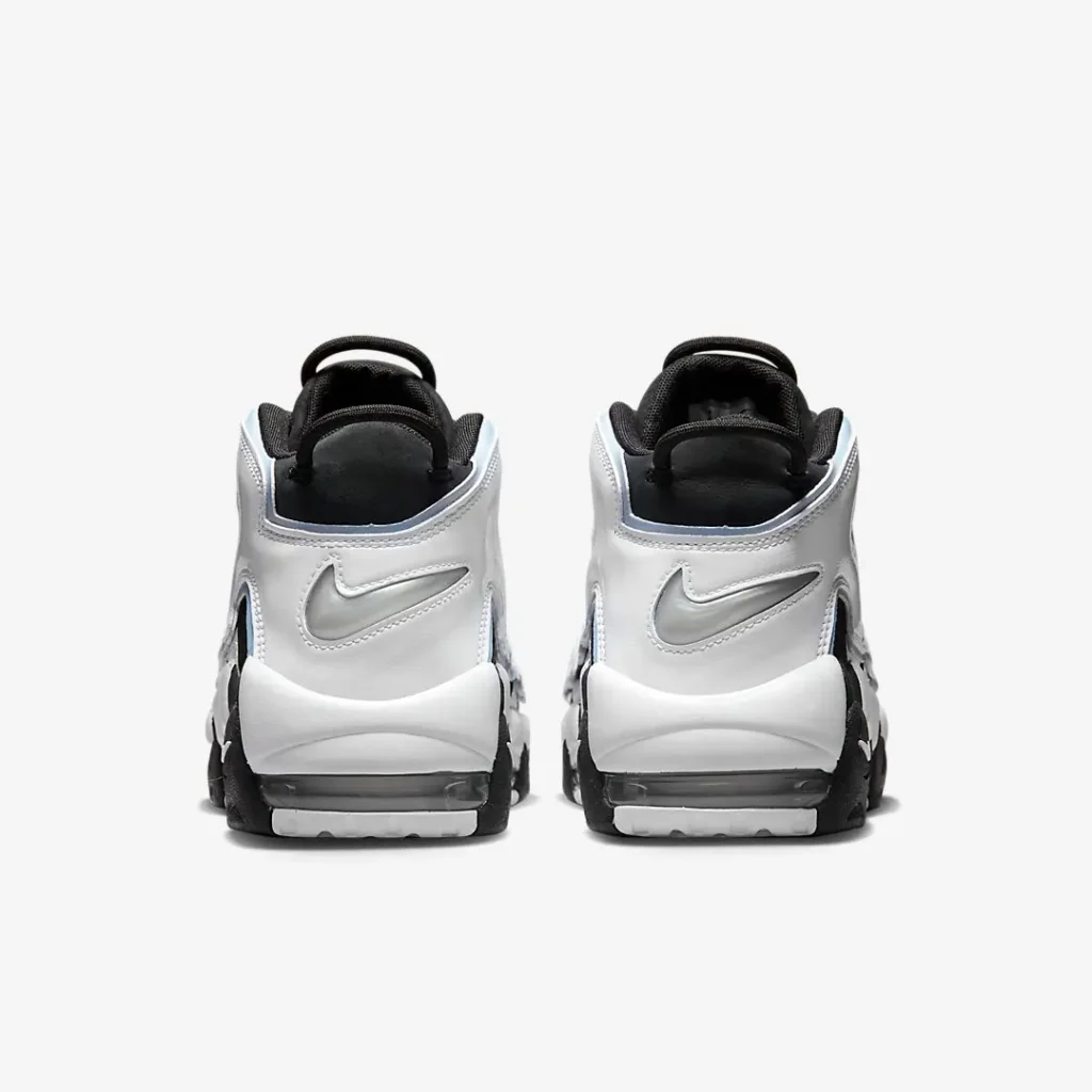 Heel view featuring metallic silver Nike Swooshes, padded black collars, pull tabs, and full-length visible Air units integrated into the white and black midsole