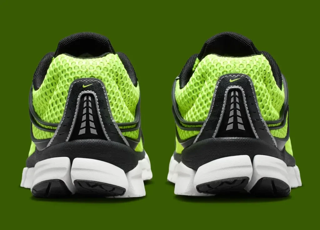 Rear view of the Nike Zoom Skylon 11 highlighting the volt mesh heel, black heel counter with reflective detailing, padded black collar, and sculpted white segmented heel cushion