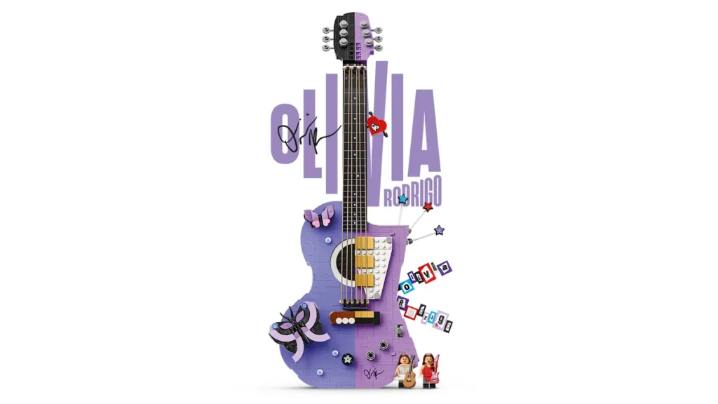 Large purple LEGO guitar with “OLIVIA RODRIGO” text and signature. Decorated with butterflies, stars, and two small minifigures at the bottom. Clean white background product shot
