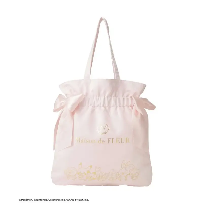 Soft pink Maison de FLEUR tote bag featuring a gathered drawstring-style opening, double ribbon bows at the sides, gold logo branding, and subtle Pokémon Poképeace-inspired floral embroidery on a clean white background.