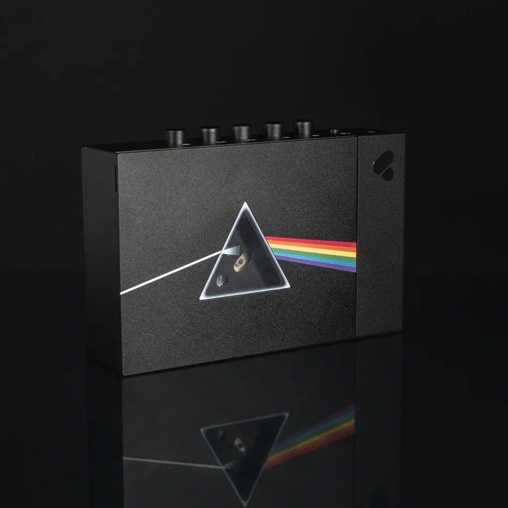 Front view of the Pink Floyd special edition We Are Rewind cassette player finished in matte black with The Dark Side of the Moon prism and rainbow artwork across the face
