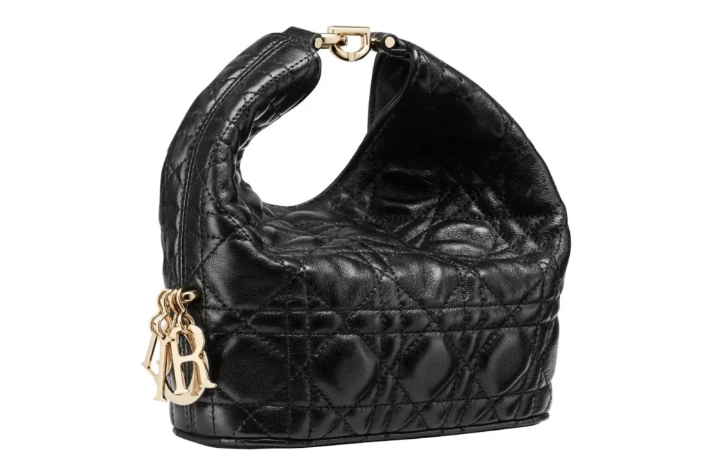 Black Dior quilted leather hobo bag with oversized Cannage stitch, gold CD charms, and a padded shoulder strap