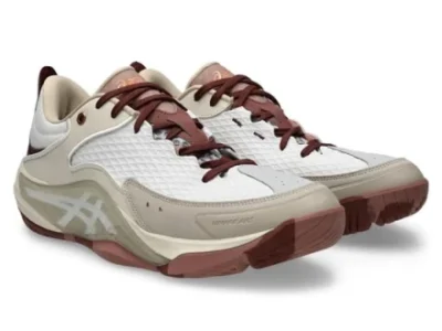 White and cream ASICS court shoe with burgundy laces, translucent side support, and rose-brown outsole shown as a pair from a front angle