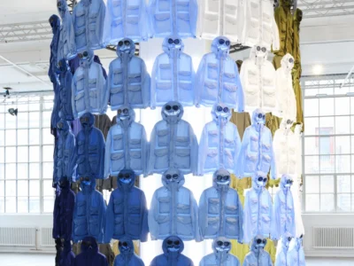 Large circular install filled with C.P. Company goggle jackets in shades of blue, white and olive