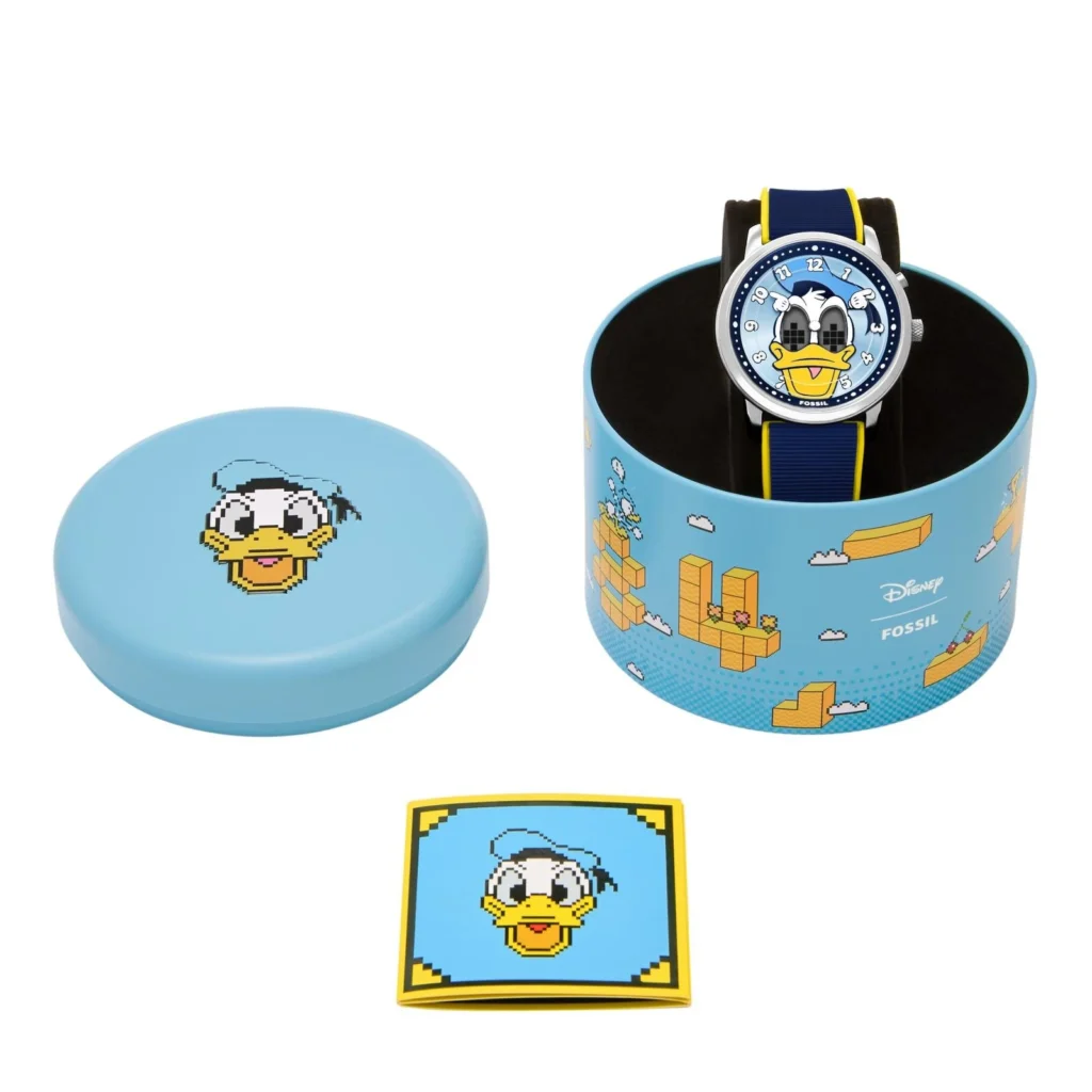 Fossil Donald Duck Watch Sits Inside A Blue Disney Collector Tin With A Match Pin