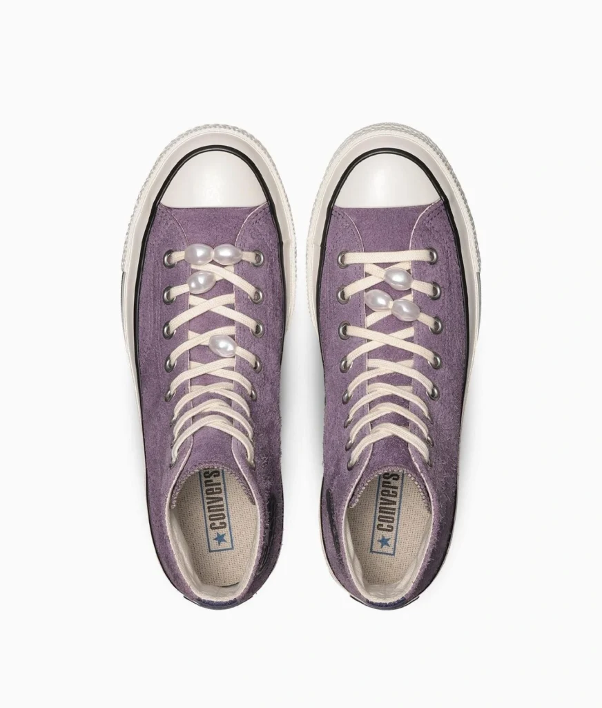 Top View Of Purple Suede Converse High-Tops With Cream Laces And Pearl Embellishment