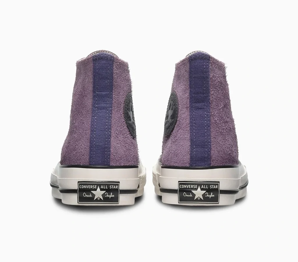 Rear View Of Purple Suede Converse Chuck 70 High-Tops With Dark Purple Heel Stripe