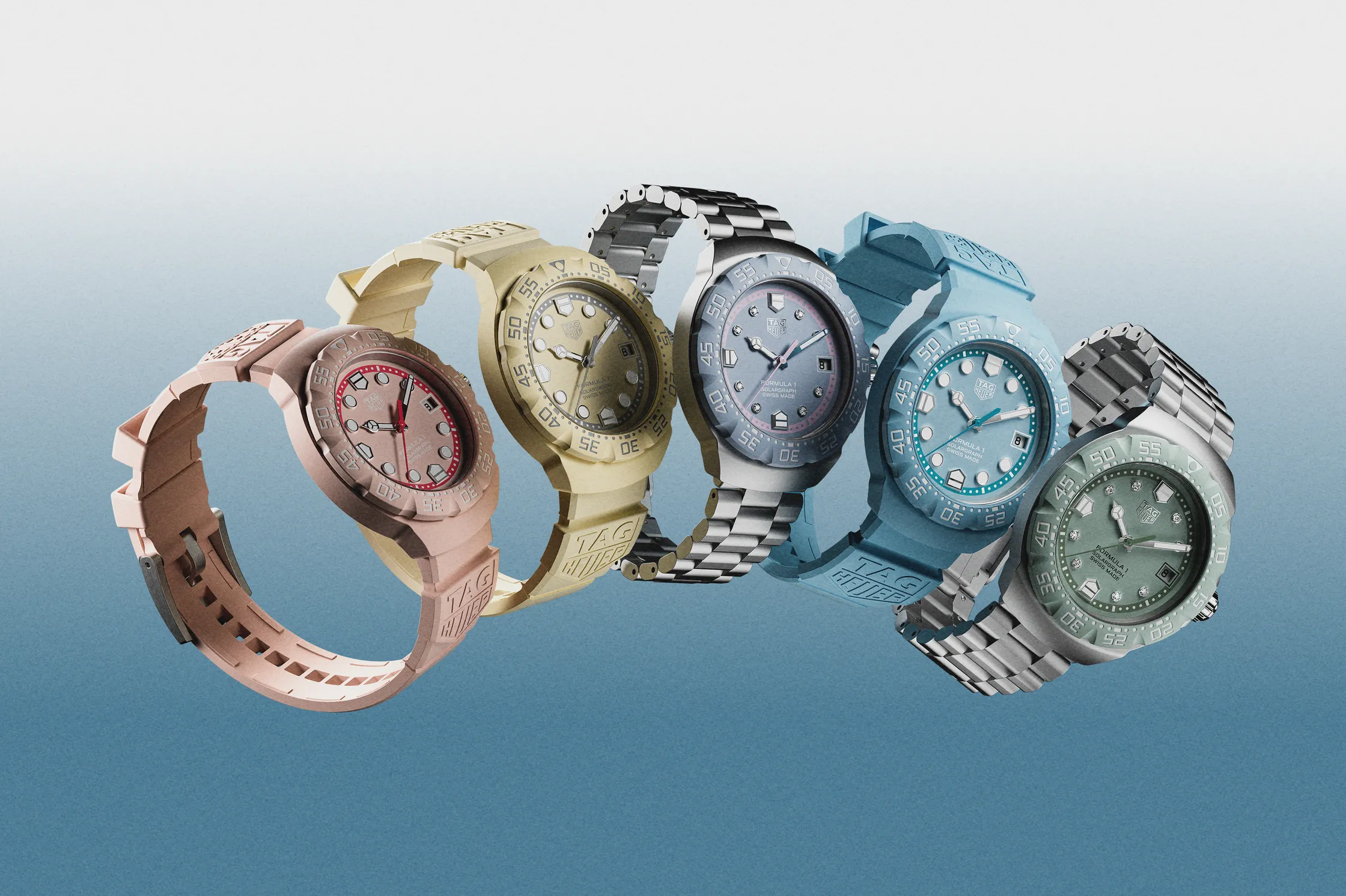 Five TAG Heuer Formula 1 Solargraph watches displayed in pink, yellow, silver, blue and green colorways with rubber and stainless-steel bracelets.