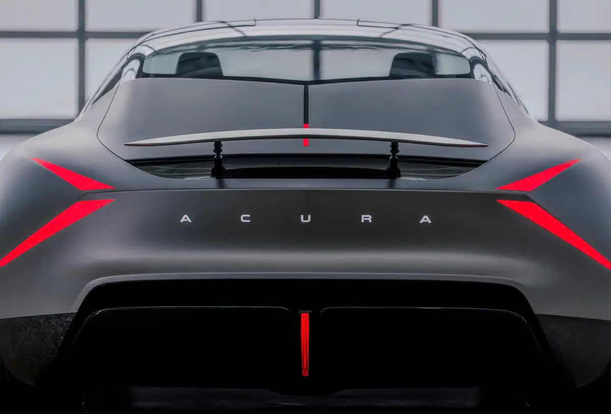 Rear Close-Up Of The Acura NEXERA Vision Highlighting Angular Red LED Taillights, Illuminated Acura Lettering, And A Raised Active Rear Wing.