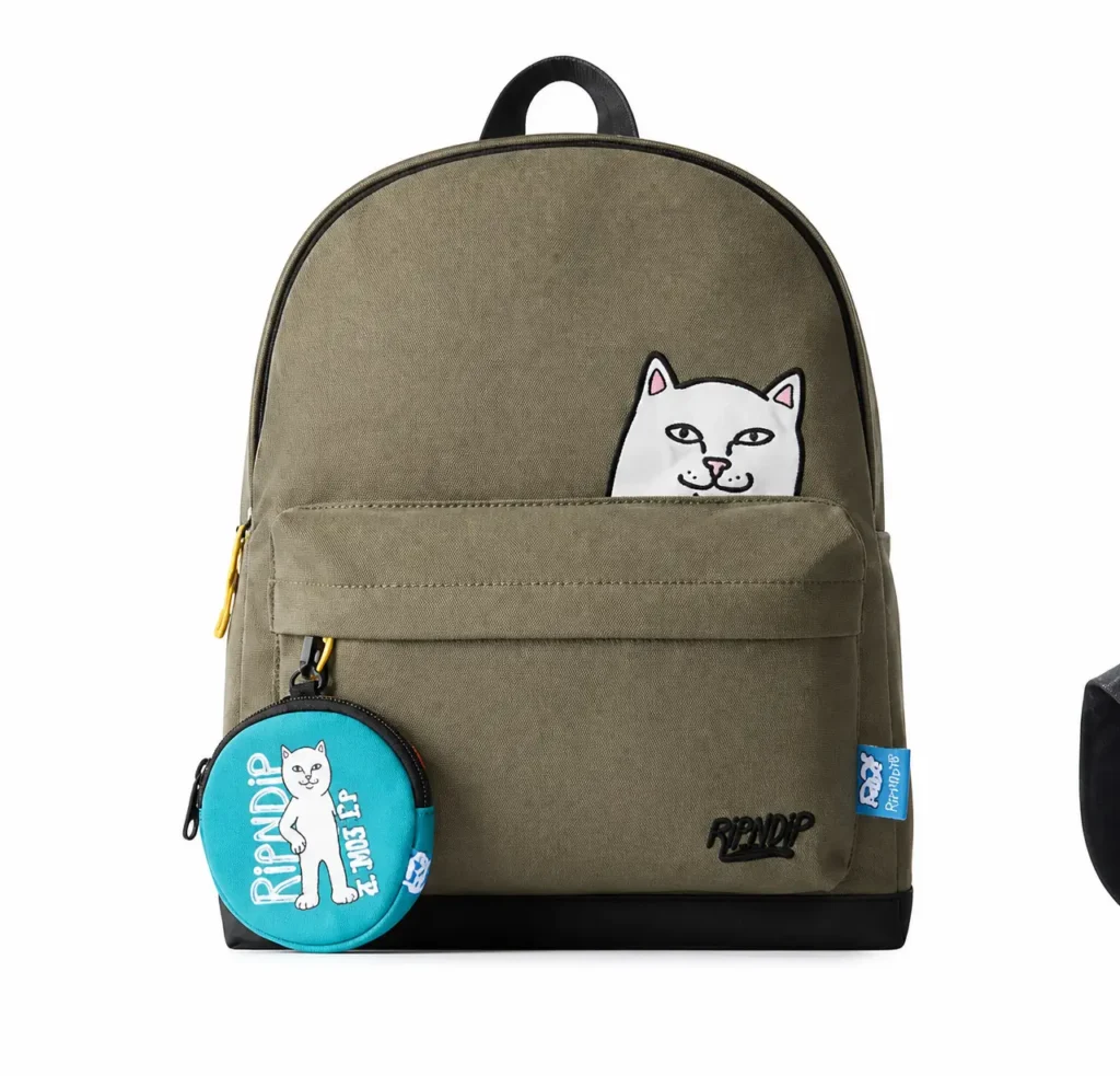 Olive RIPNDIP backpack with a cat graphic peek over the front pocket and turquoise accessor pouch