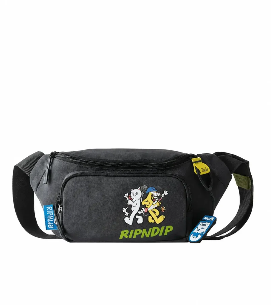 Black RIPNDIP waist bag with colorful cartoon graphics, green logo letter, and brand tag