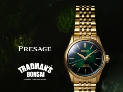 Seiko Presage TRADMAN'S BONSAI LE promo. Gold watch, green dial, against dark bonsai foliage, vintage text