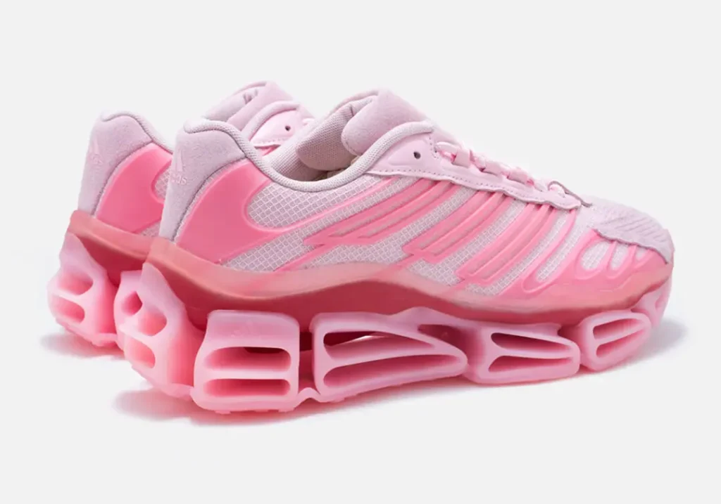 Rear three-quarter view of the pink adidas x Willy Chavarria shoe showcasing glossy heel counters, a breath mesh construction, and the sculpture hollow midsole design