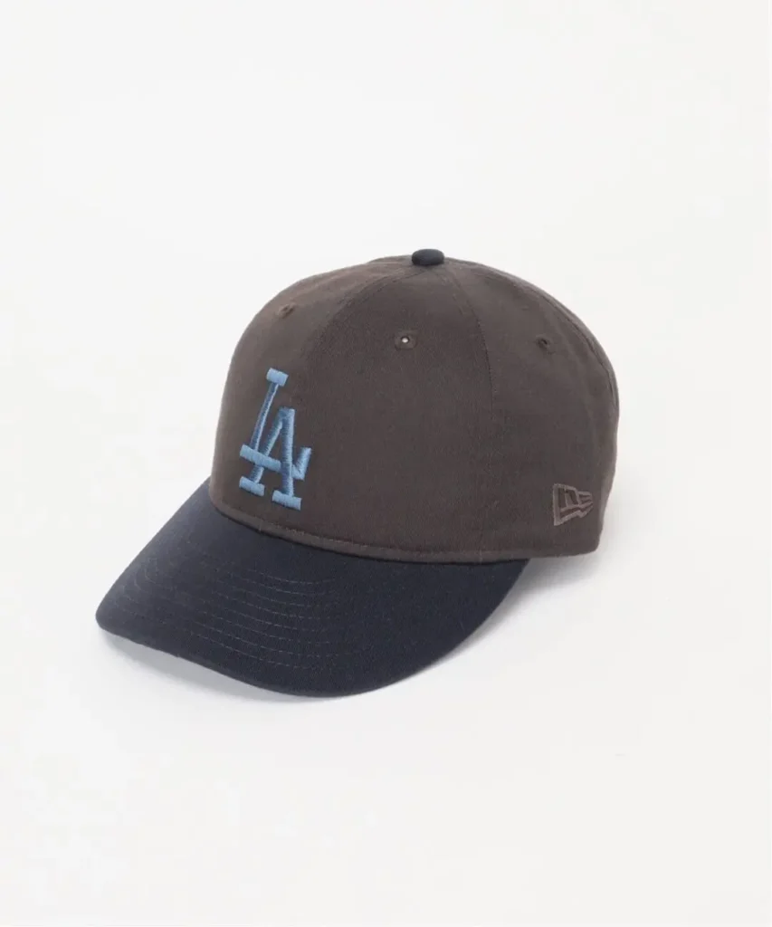 Black-and-brown baseball cap with blue LA embroidery and a New Era logo on a white background