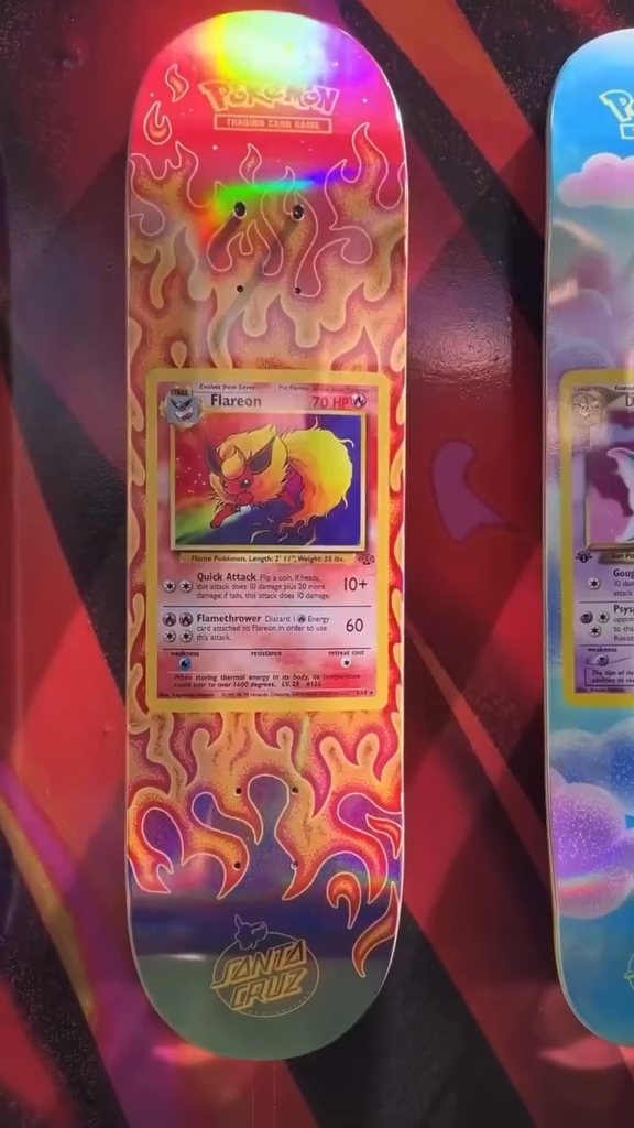 Flareon Pokémon skateboard deck with orange flame graphics and a visible trading card panel