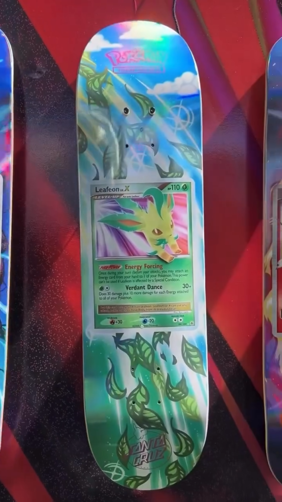Pokémon-themed Santa Cruz skateboard deck featuring a Leafeon trading card and green leaf graphics