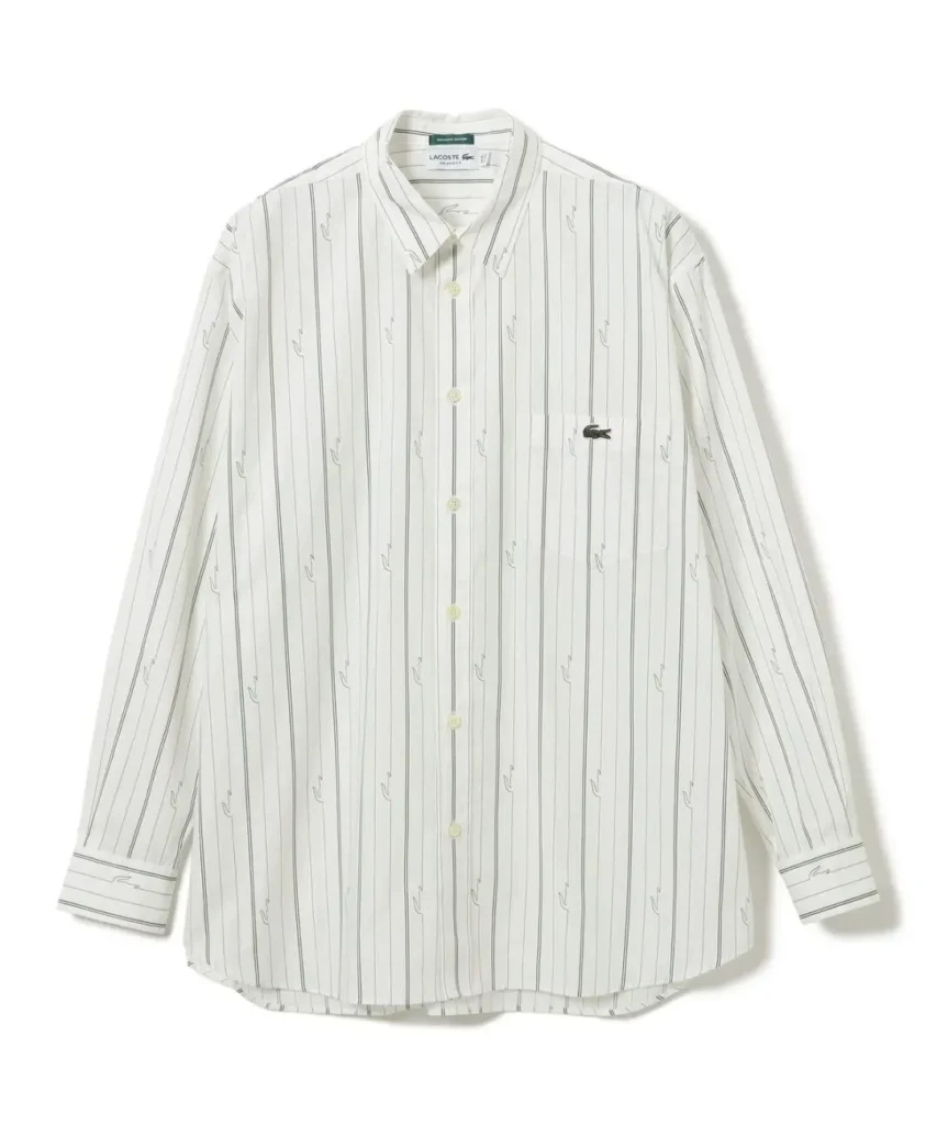 White long-sleeve Lacoste button-up shirt with thin vertical stripes and repeating crocodile motifs, laid flat on white