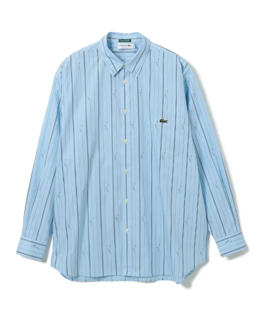 Light blue Lacoste button-up shirt with vertical stripes and repeating crocodile motifs, displayed flat on white background