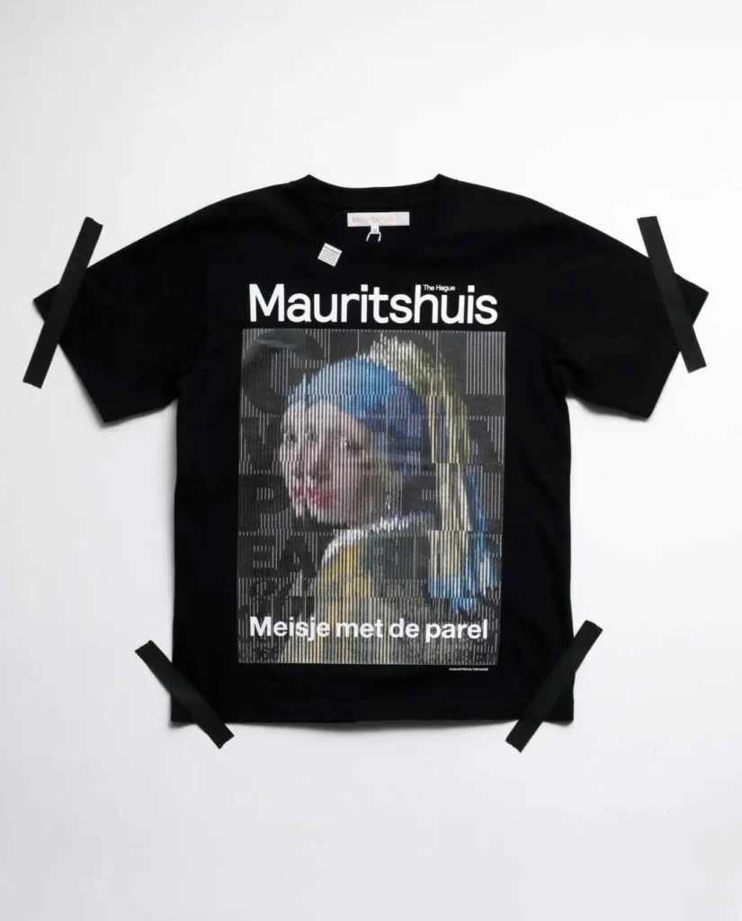 Black Tee feature a pixelated interpretation of Girl with a Pearl Earring beneath Mauritshuis brand and Dutch title text