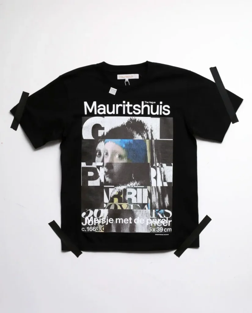 Black Tee featuring a glitch-inspired collage of Vermeer's Girl with a Pearl Earring layered with fragment typography and grayscale graphic