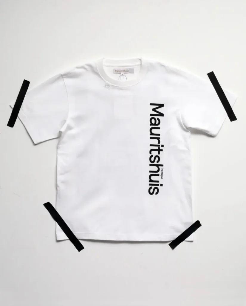 White Tee with minimalist vertical Mauritshuis branding printed along the right side of the front